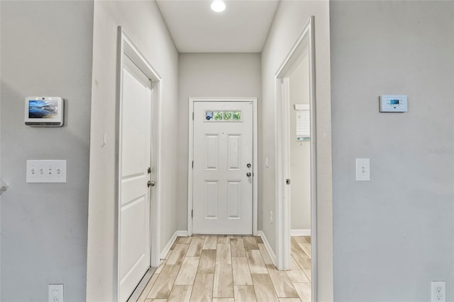 2612 E 26th Ave, Tampa, FL 33605 - doorway featuring baseboards and light wood finished floors