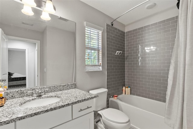2612 E 26th Ave, Tampa, FL 33605 - bathroom featuring visible vents, vanity, toilet, and shower / tub combo with curtain