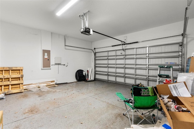 2612 E 26th Ave, Tampa, FL 33605 - garage featuring electric panel and a garage door opener