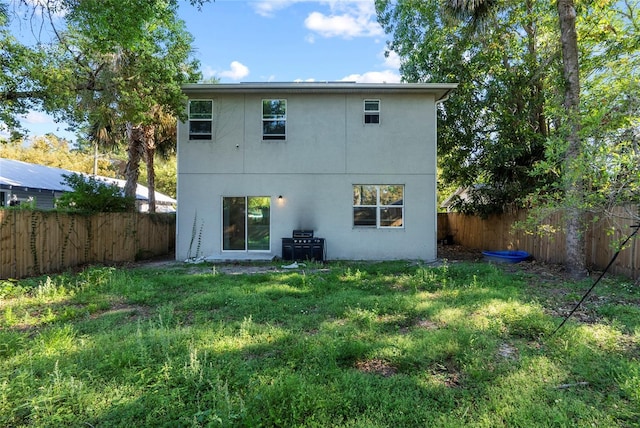 2612 E 26th Ave, Tampa, FL 33605 - rear view of house featuring a yard and a fenced backyard
