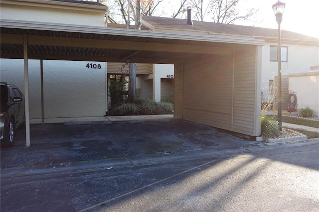 view of exterior entry featuring covered parking