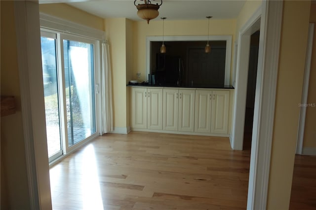 interior space with plenty of natural light and light wood-style flooring