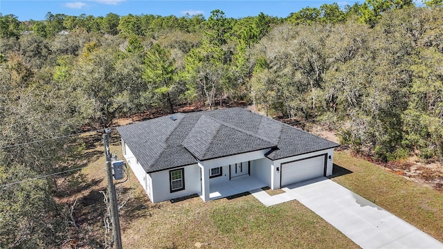 drone / aerial view with a view of trees