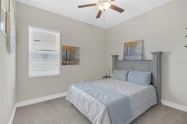 bedroom with baseboards, carpet floors, and ceiling fan