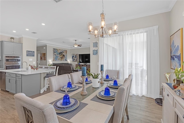 dining area featuring recessed lighting, light wood finished floors, crown molding, and ceiling fan with notable chandelier