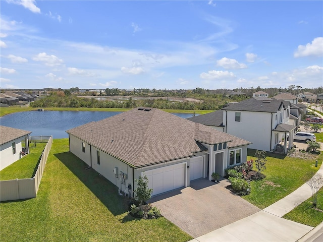 drone / aerial view featuring a residential view and a water view