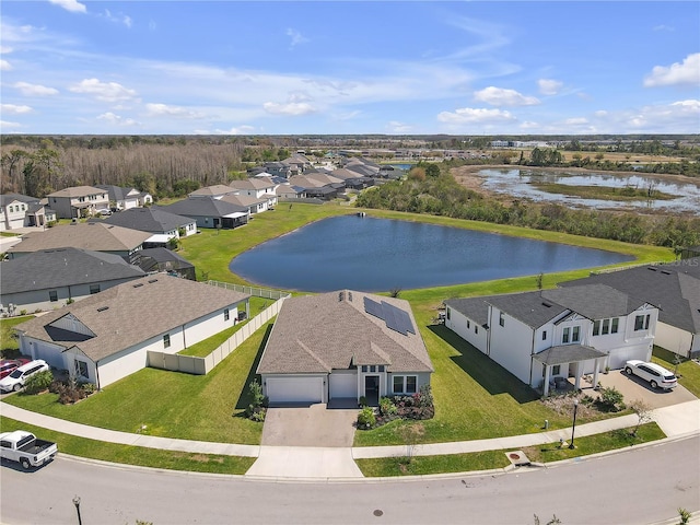 birds eye view of property featuring a residential view and a water view