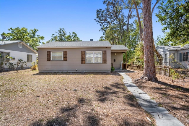 view of front of home featuring fence