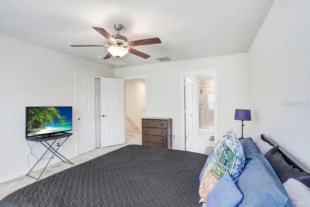 unfurnished bedroom with a ceiling fan, carpet, visible vents, a closet, and ensuite bathroom