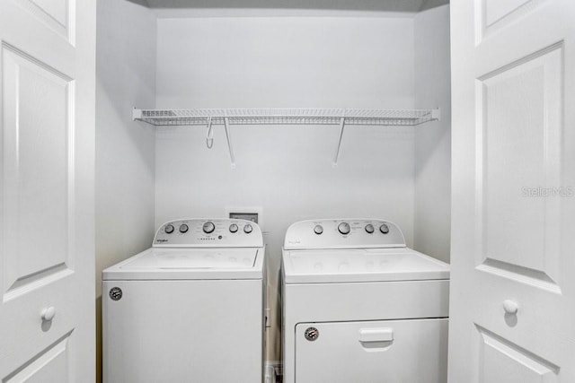 laundry area featuring laundry area and washing machine and clothes dryer