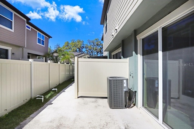 view of patio / terrace with central AC unit and a fenced backyard