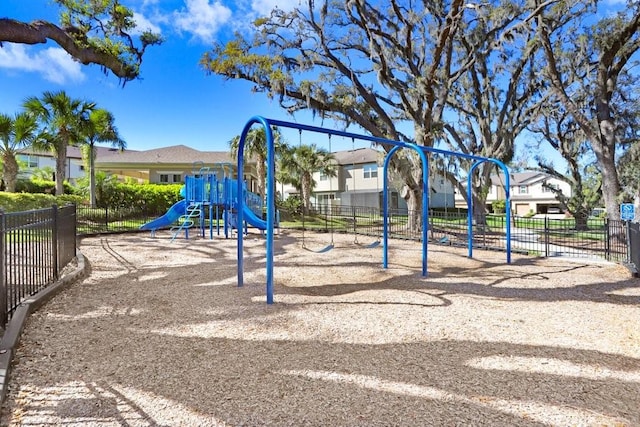 community jungle gym featuring fence