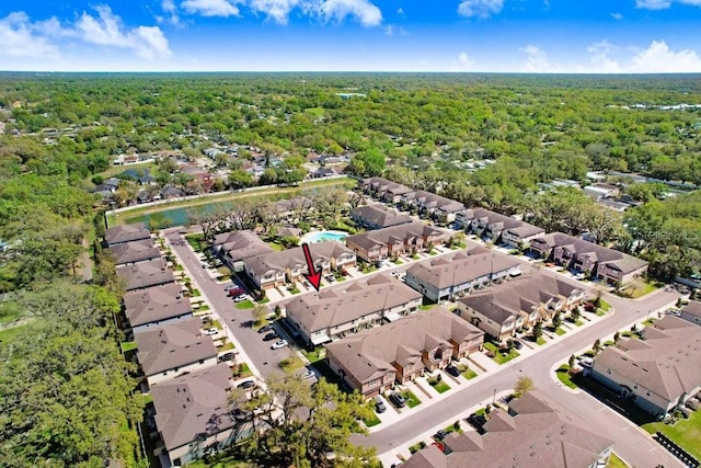 bird's eye view with a residential view and a wooded view