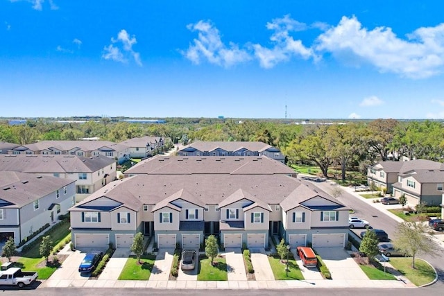 birds eye view of property with a residential view