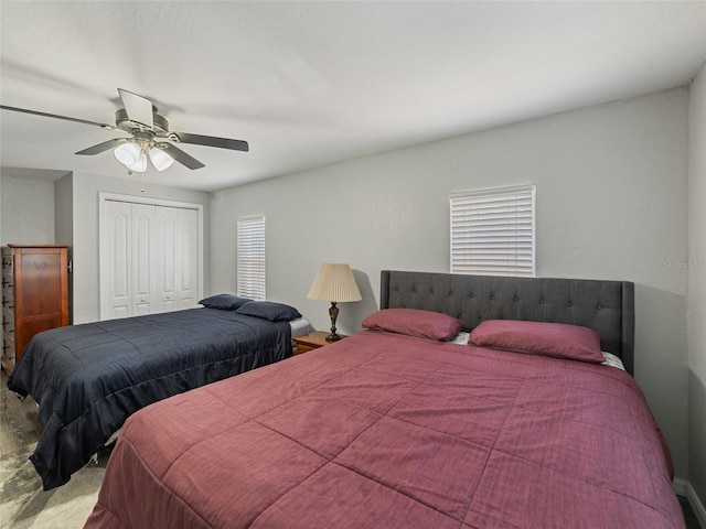 bedroom featuring a ceiling fan and a closet