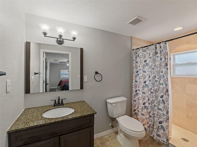 full bath with visible vents, toilet, vanity, a stall shower, and ensuite bath