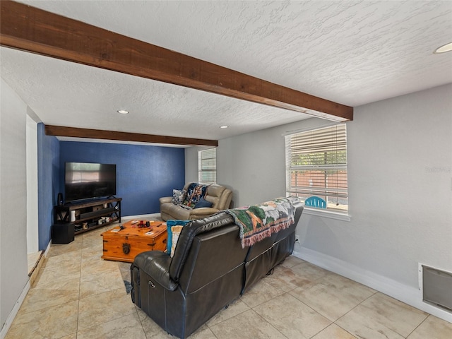 living area with beamed ceiling, a textured ceiling, recessed lighting, light tile patterned flooring, and baseboards