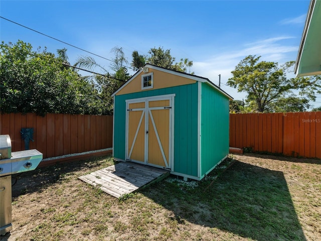 view of shed featuring a fenced backyard