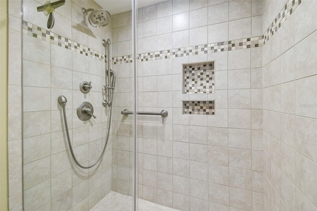 bathroom with a tile shower