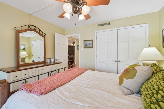 bedroom with a closet, visible vents, and a ceiling fan