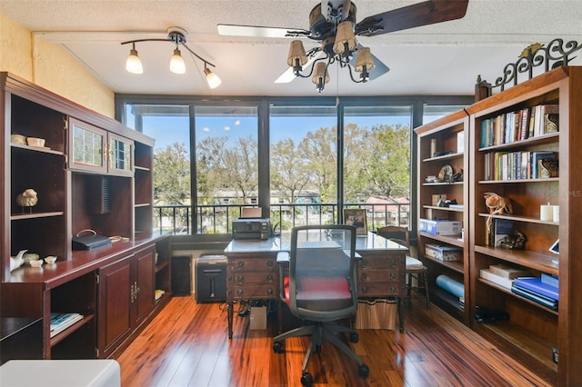 office space with light wood-type flooring, a textured ceiling, and a ceiling fan