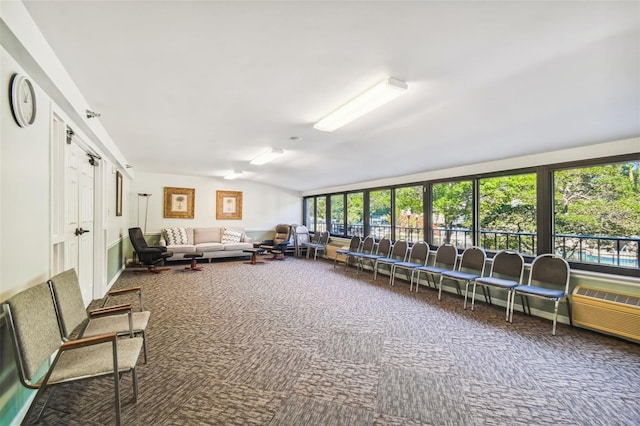 living room with lofted ceiling and carpet