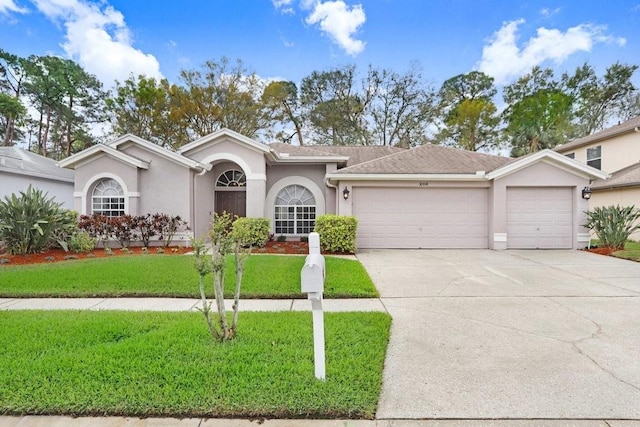 ranch-style home with stucco siding, driveway, a front lawn, and an attached garage