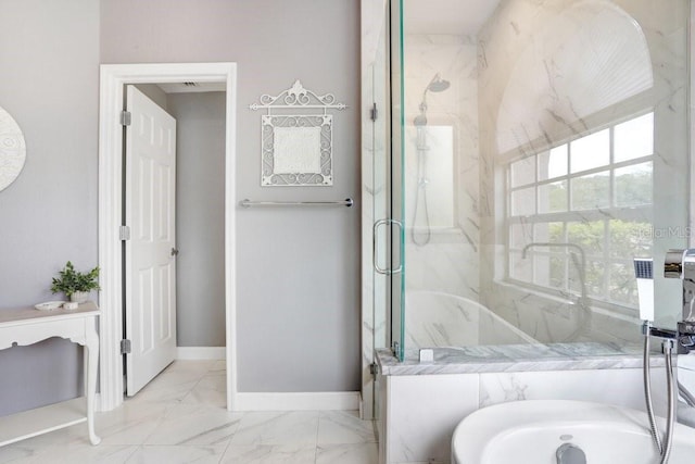 full bath with a marble finish shower, marble finish floor, a tub, and baseboards