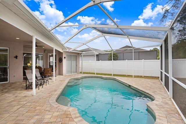 view of pool featuring a patio area, a fenced in pool, ceiling fan, and fence