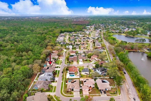 birds eye view of property featuring a water view and a residential view