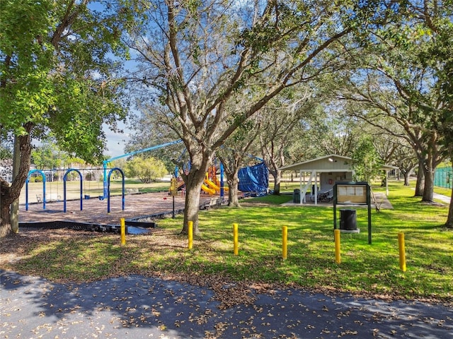 community jungle gym with a yard