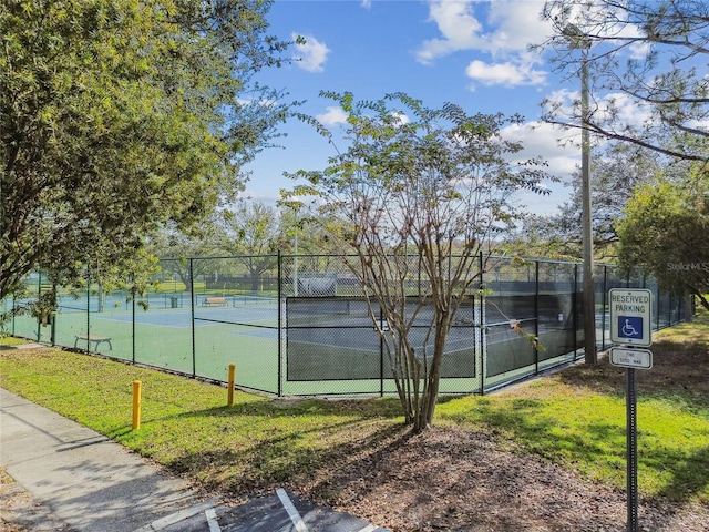 view of tennis court with fence