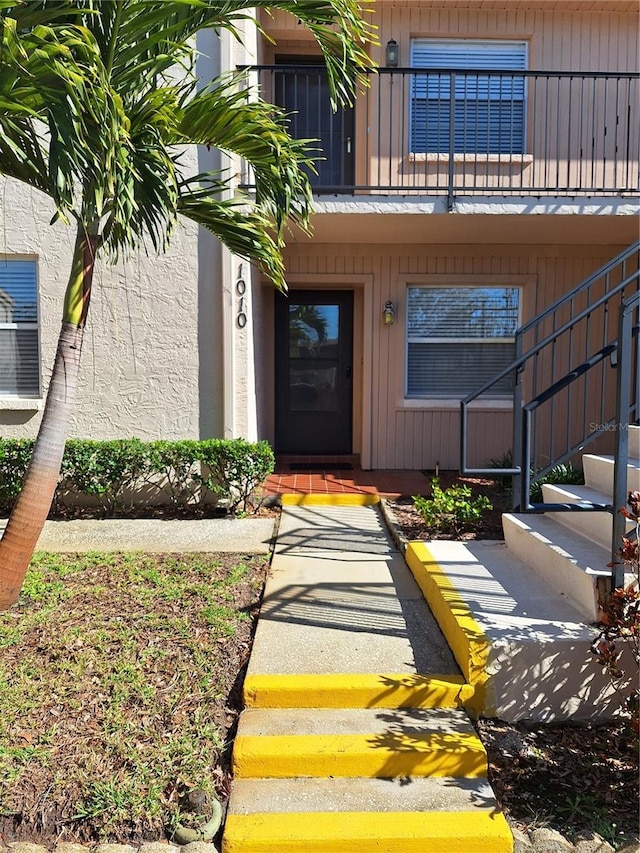 doorway to property featuring a balcony