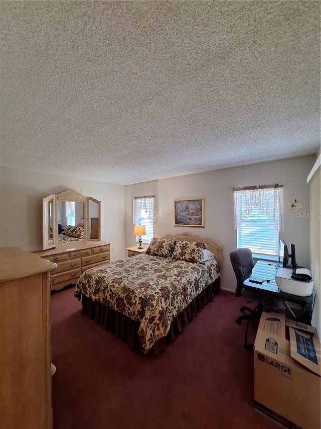 carpeted bedroom featuring a textured ceiling