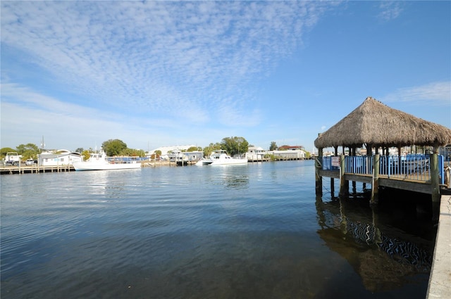 view of dock featuring a gazebo and a water view