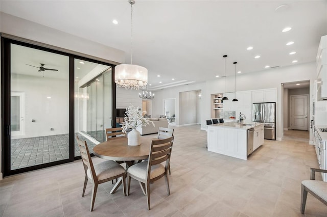 dining area with recessed lighting and ceiling fan with notable chandelier