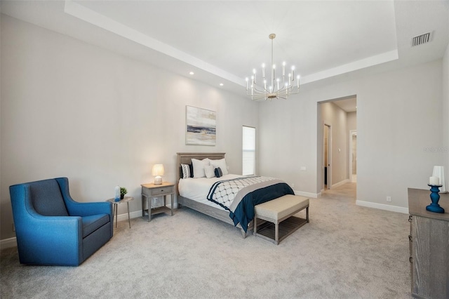 bedroom featuring visible vents, baseboards, carpet, a chandelier, and a tray ceiling