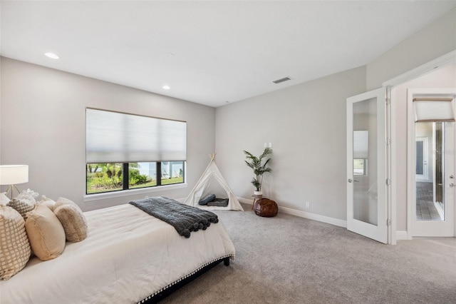 bedroom featuring recessed lighting, visible vents, baseboards, and carpet