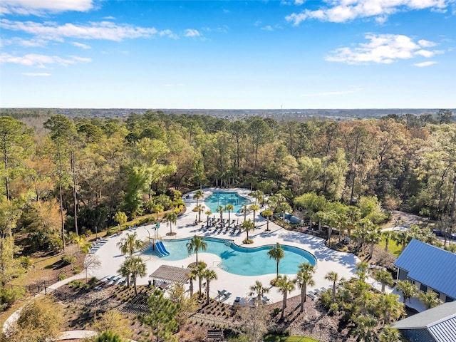 aerial view featuring a wooded view