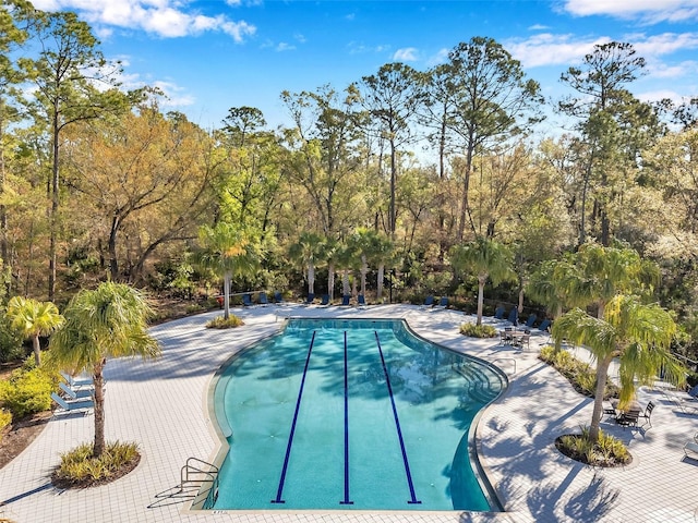 community pool featuring a patio area