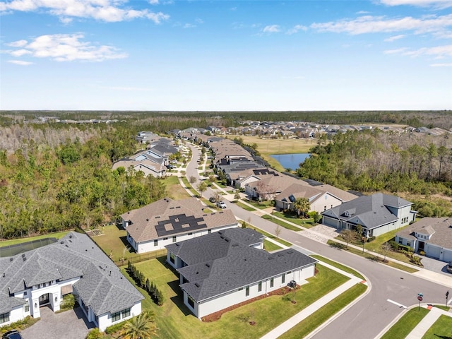 bird's eye view with a residential view and a water view