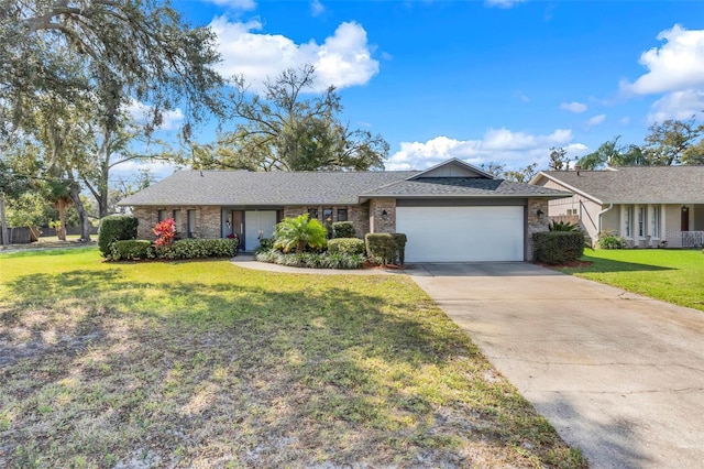 single story home with a front yard, roof with shingles, an attached garage, concrete driveway, and brick siding