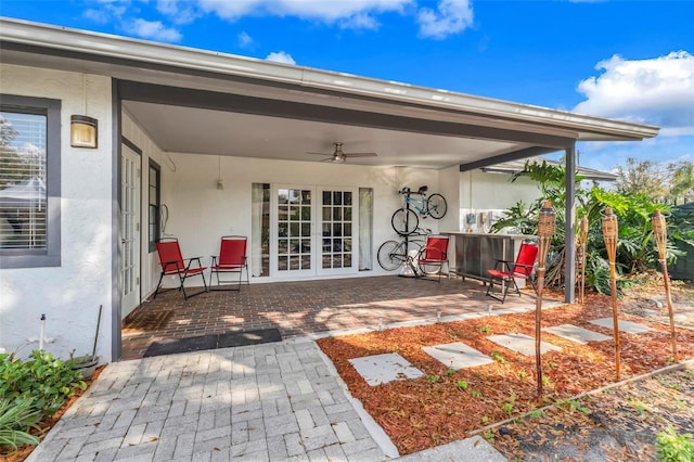 view of patio / terrace with french doors and a ceiling fan