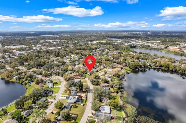 birds eye view of property with a water view