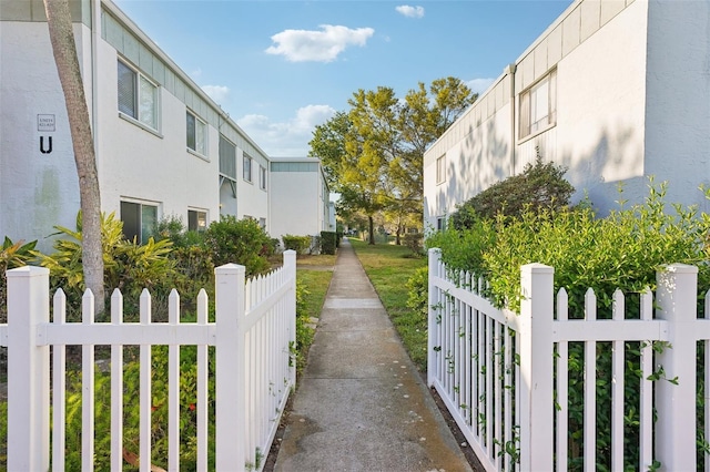 view of home's community featuring a residential view and a fenced front yard