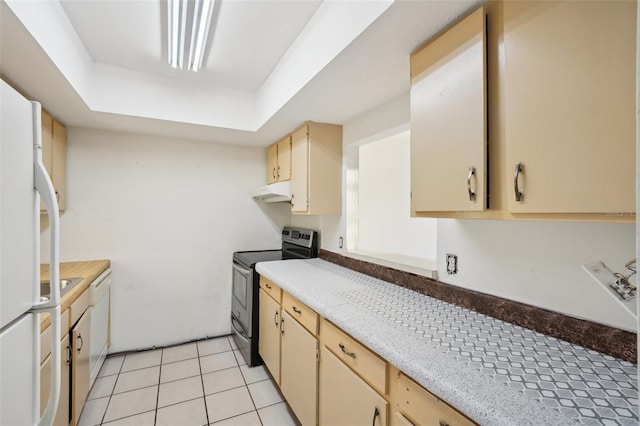 kitchen with light tile patterned floors, white appliances, under cabinet range hood, and light countertops