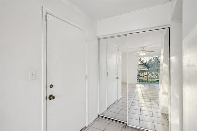 corridor with light tile patterned floors