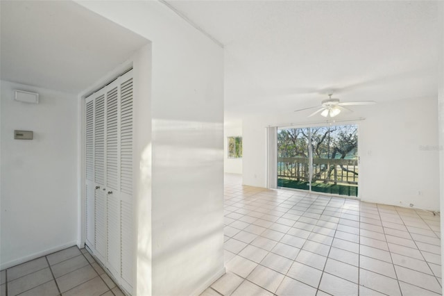 hallway featuring light tile patterned flooring