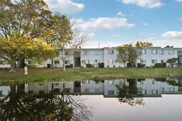 view of property with a water view