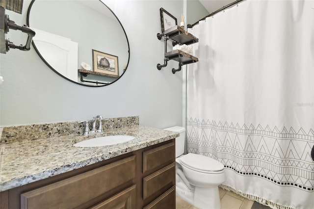 bathroom with vanity, tile patterned floors, curtained shower, and toilet